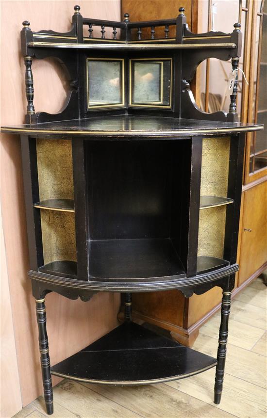 A Victorian parcel gilt ebonised Aesthetic movement cabinet H.133cm